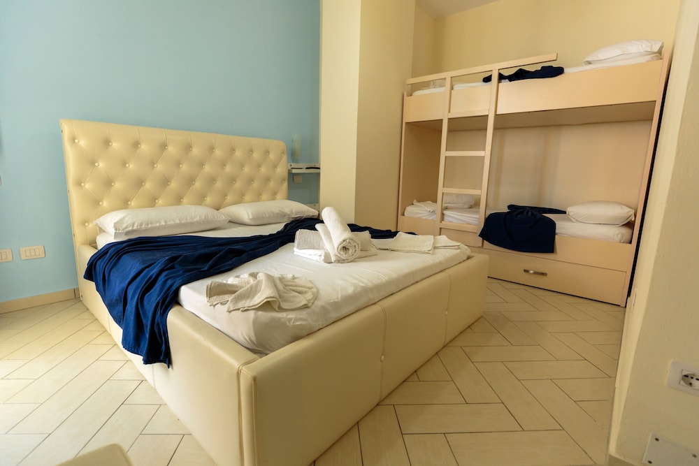 Quadruple Room, Multiple Beds, Balcony, Partial Sea View