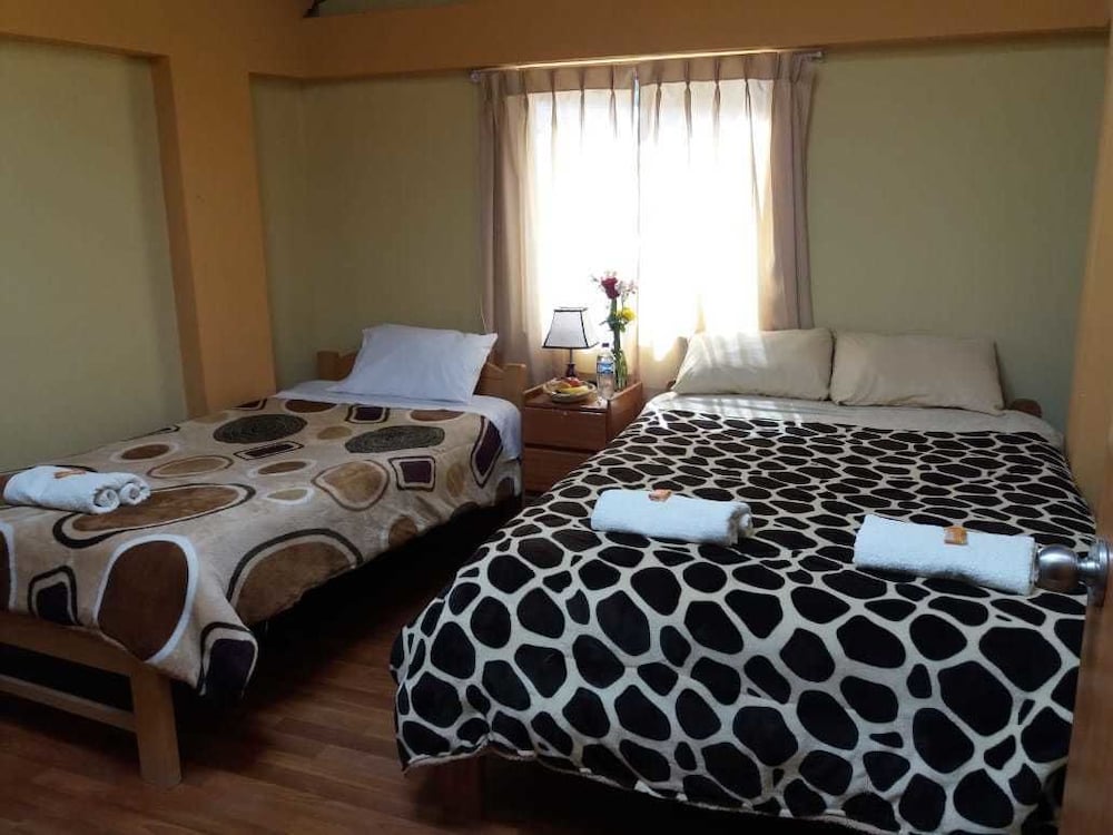 Standard Triple Room (1 Double and 1 Twin Bed) photo 1