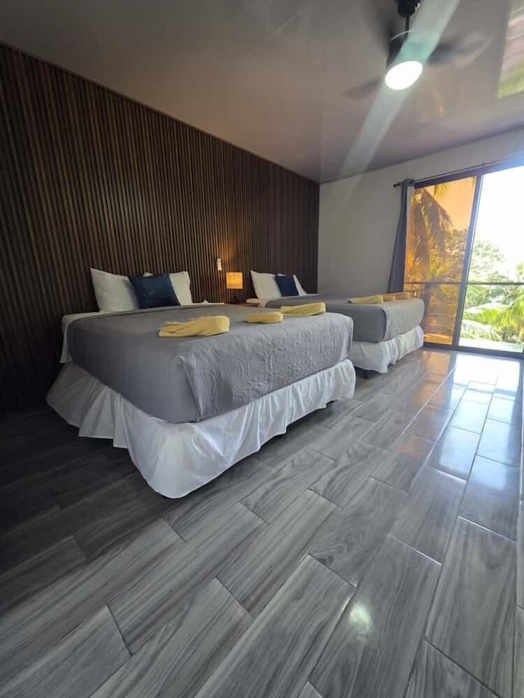 Exclusive Room, 2 Queen Beds, Balcony, Partial Ocean View