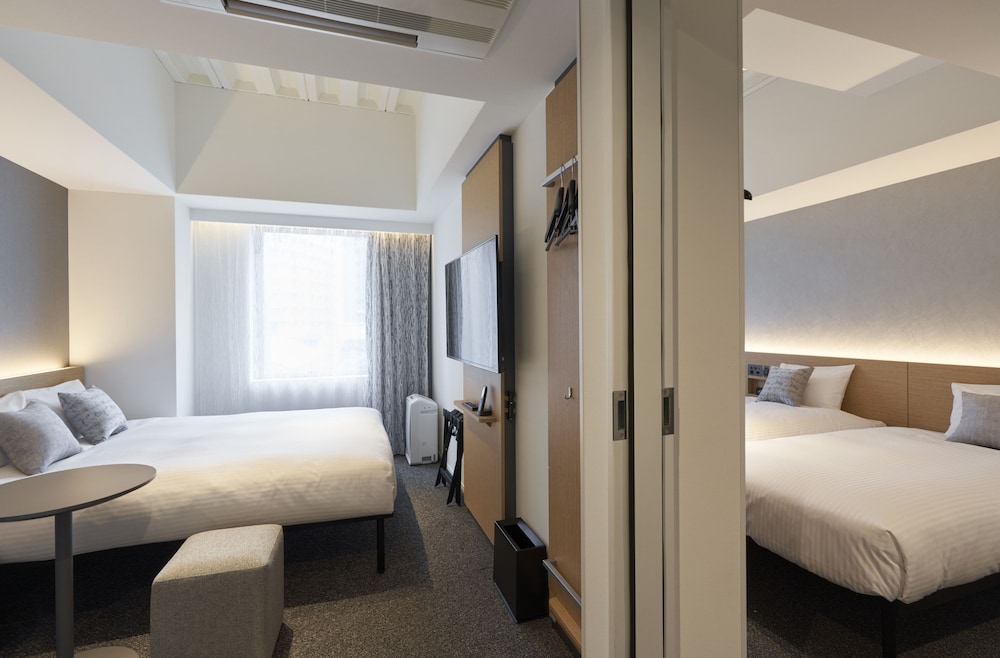 Connecting Room with 2 Single Beds and 1 Queen Bed - Photo 1