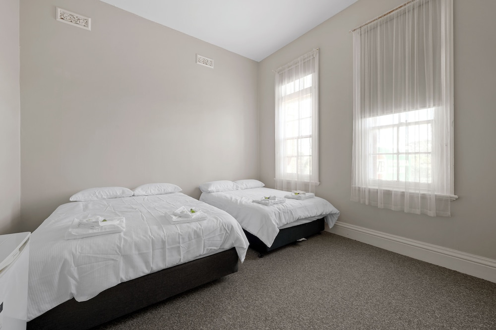 Basic Quadruple Room, Multiple Beds, Shared Bathroom