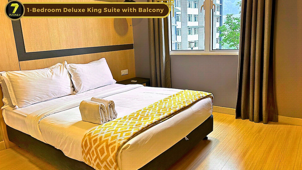 1-Bedroom Deluxe King Suite with Balcony - Photo 1