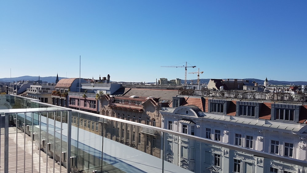 Deluxe Quadruple Room, 1 Bedroom, Balcony, City View