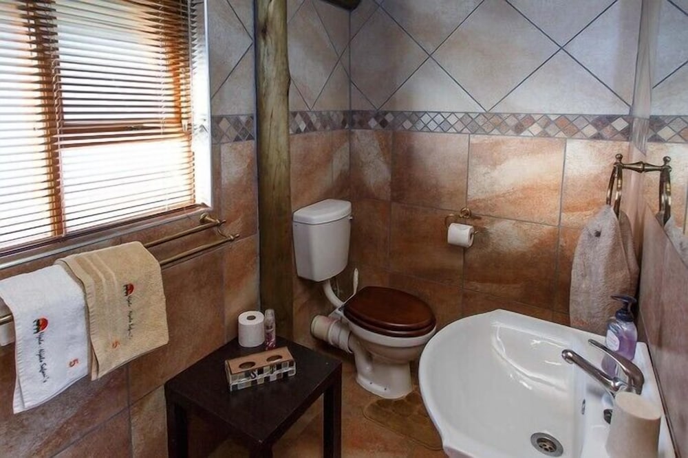Twin Bed Thatched Chalets photo 2