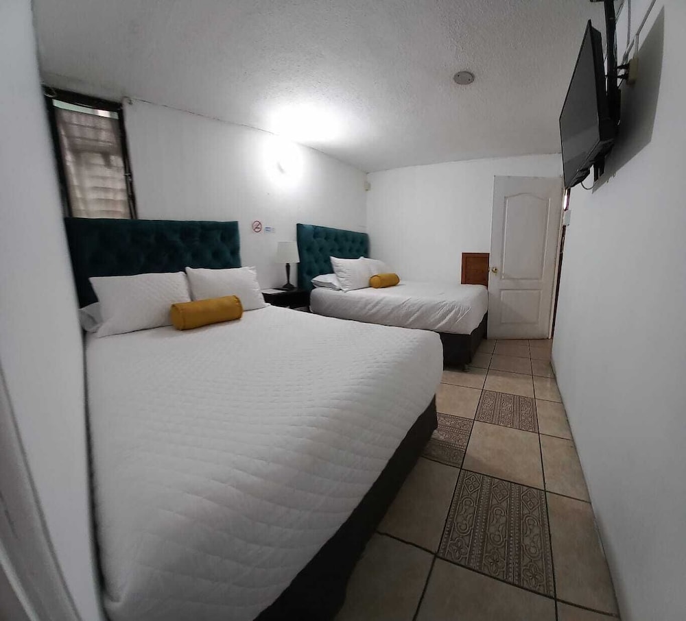 Economy Quadruple Room, 2 Double Beds, Non Smoking, Private Bathroom photo 3