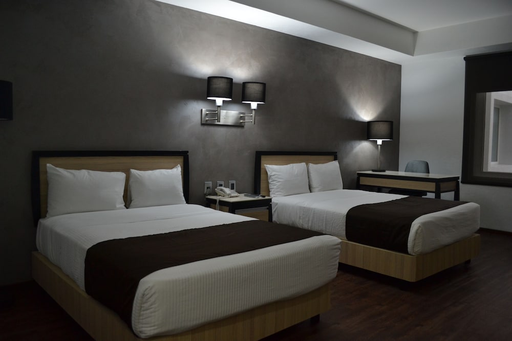 Habitación Superior con dos camas y balcón