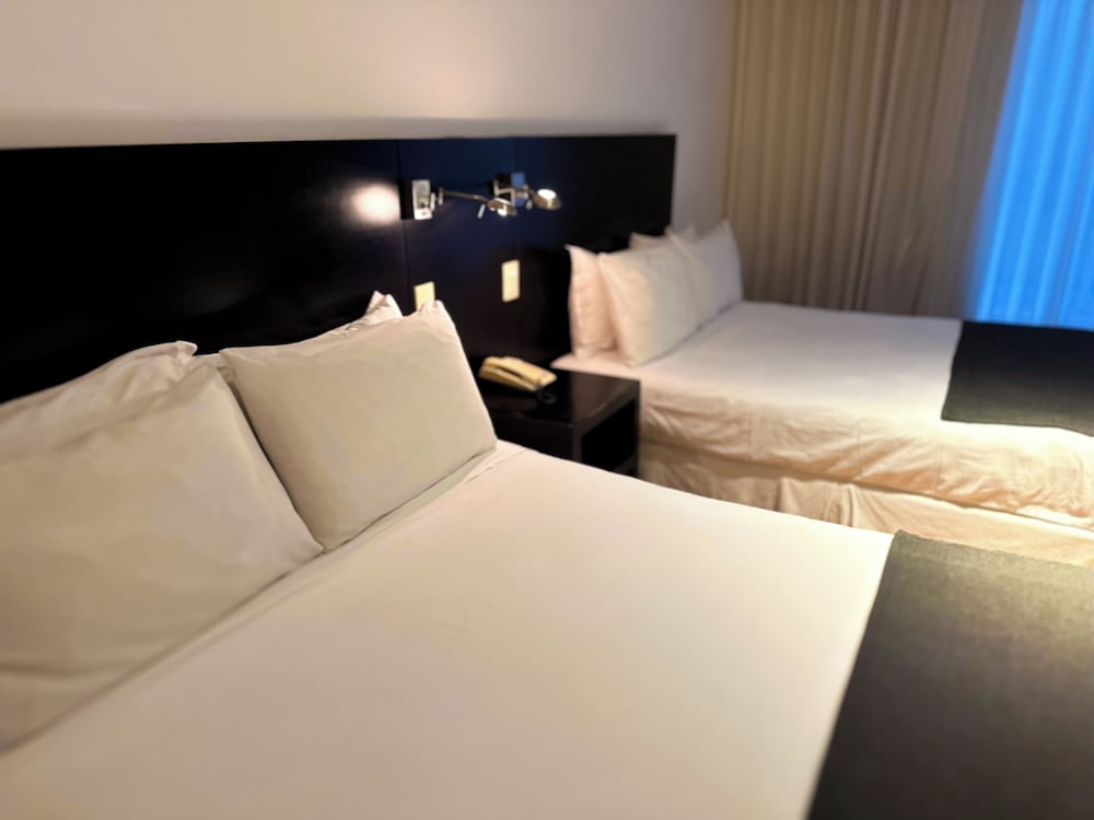 Deluxe Quadruple Room, 2 Queen Beds - Photo 1