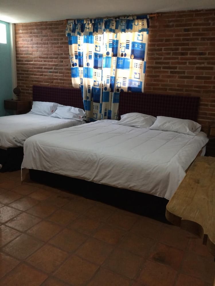Basic Quadruple Room (1 King Bed and 1 Double Bed #1) photo 1