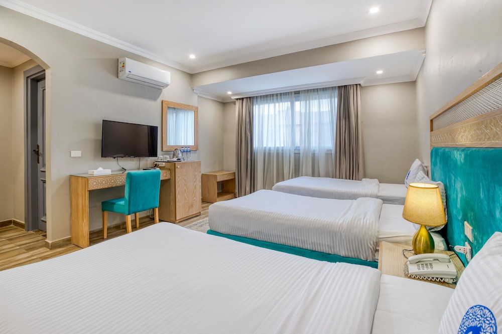 Economy Triple Room - Photo 2