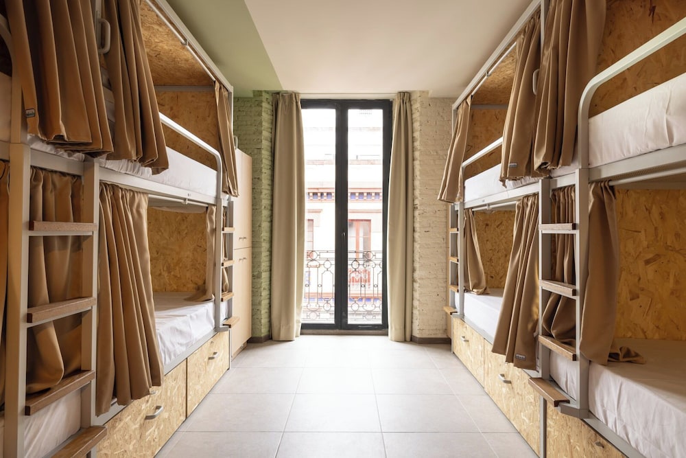 Bed in 8-bed female dormitory room