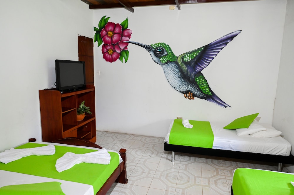 Room with 1 double bed and 3 single beds