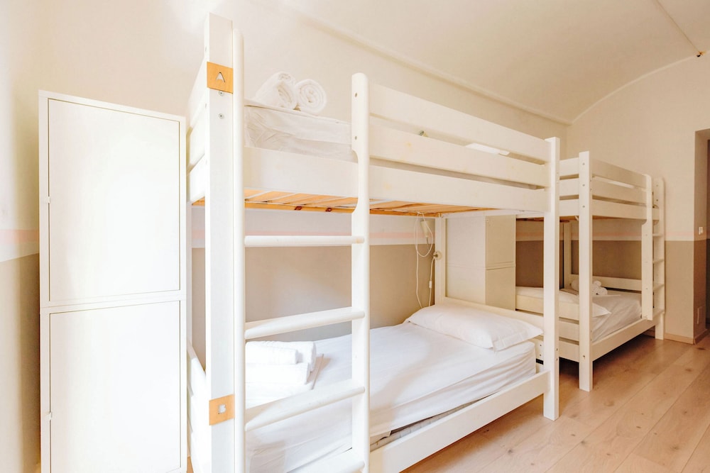 Single bed in a mixed dormitory