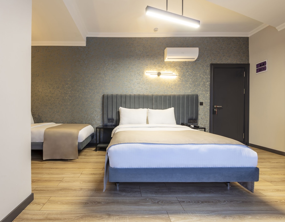 Deluxe Quadruple Room - Photo 10