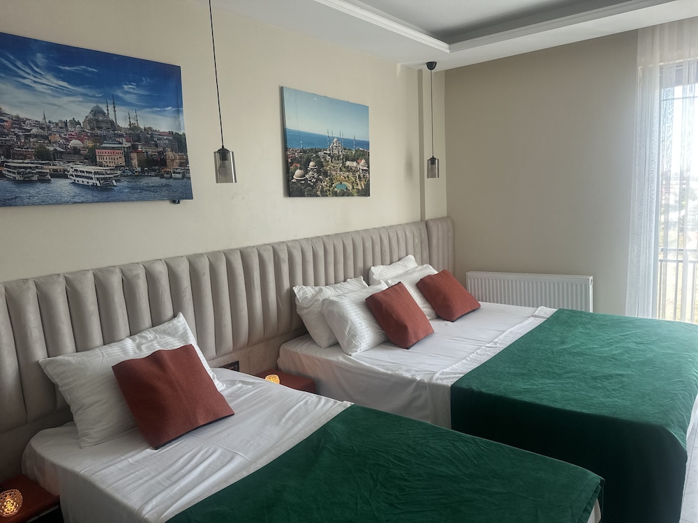 Deluxe Triple Room - Photo 11