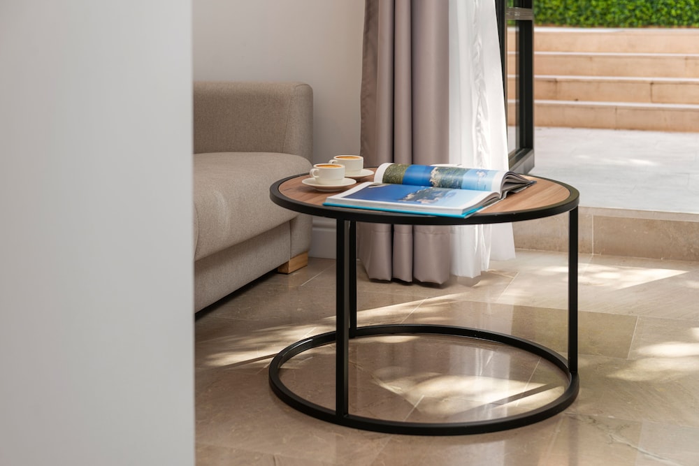 side table with a book and cup of coffee on it