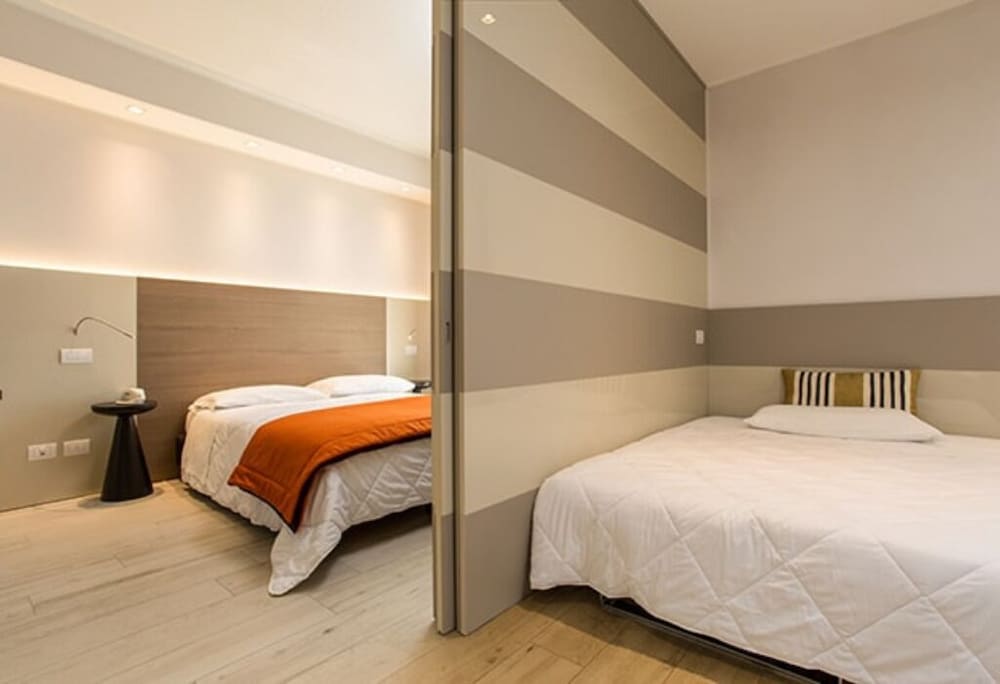 Deluxe Triple Room, 2 Bedrooms, Partial Sea View