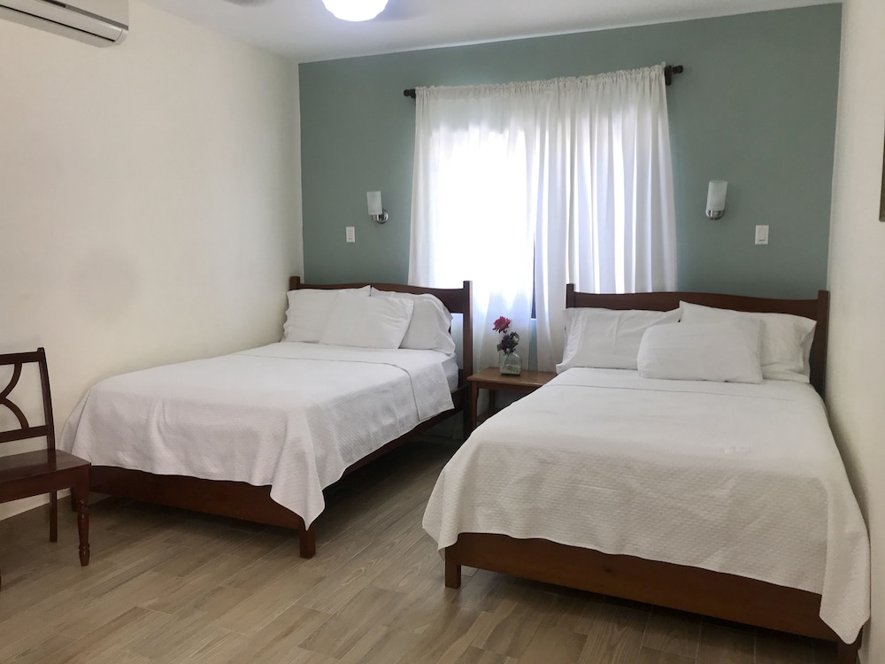 Standard Triple Room, 2 Double Beds, Refrigerator, Courtyard Area