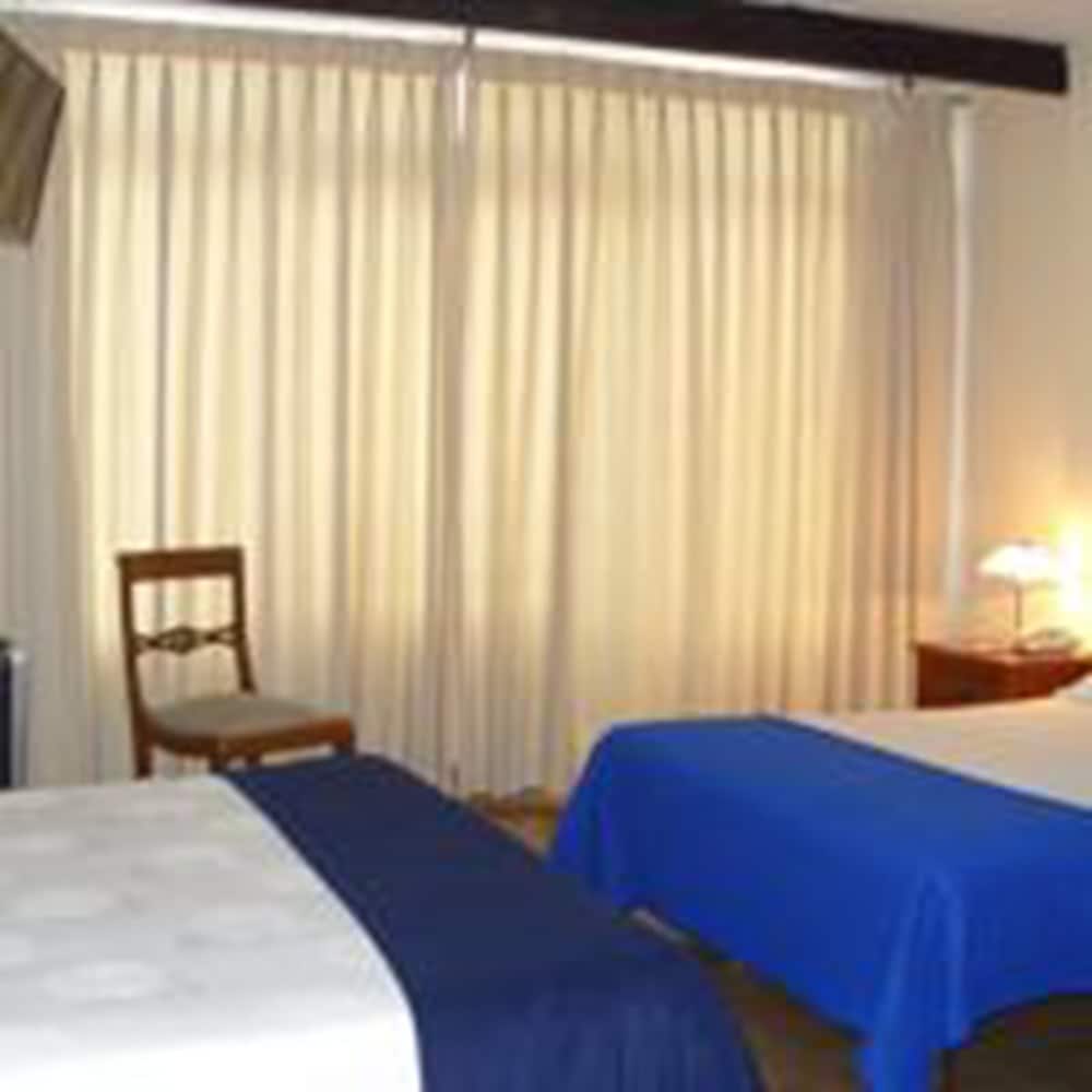 Basic Triple Room (1 Double And 1 Single Bed) photo 1