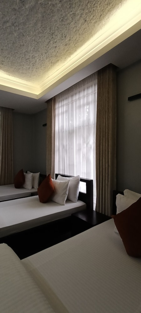 Deluxe Triple Room, Balcony, Garden View