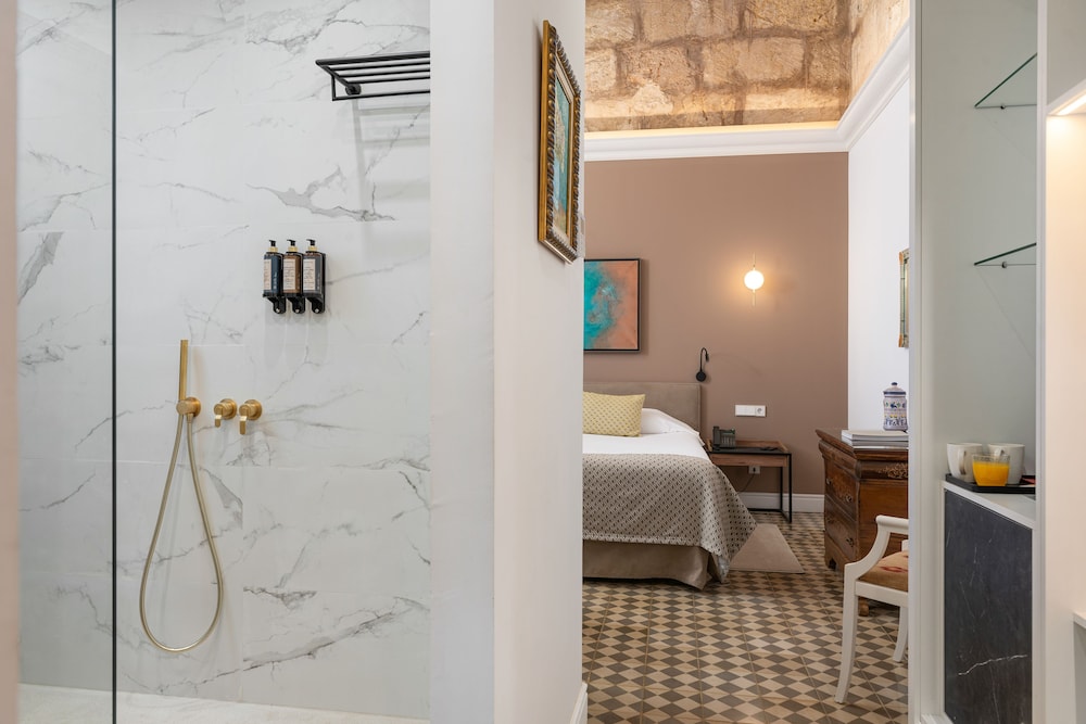 bathroom with a walk in shower and checkered floor