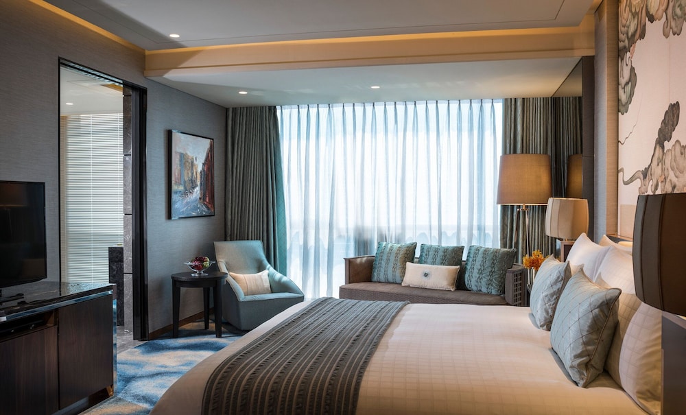 Ambassador Suite with 1 king bed & 2 Double beds