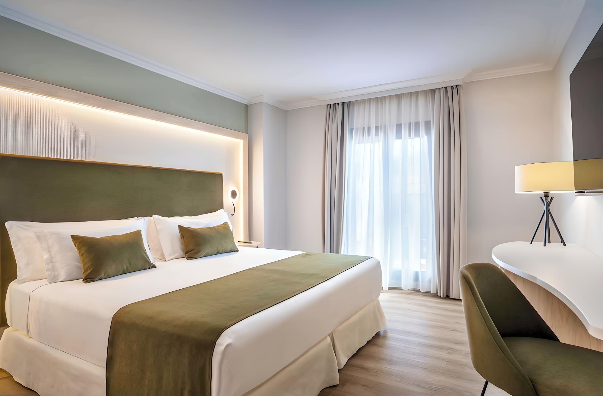 Relax in this modern and cozy hotel room.