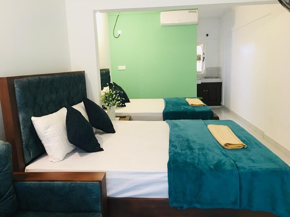 Deluxe Quadruple Room, Balcony, Garden View