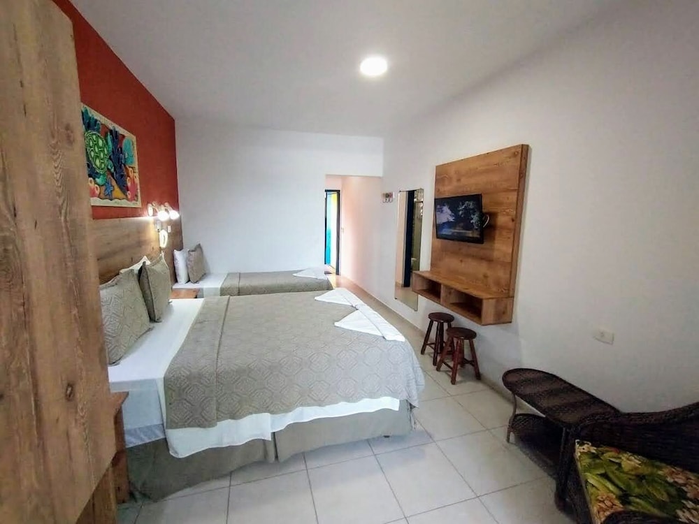Quarto Triplo Terreo Vista Parcial Mar photo 3
