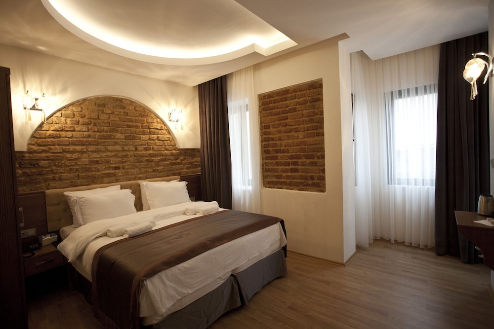 Deluxe Tek Büyük veya Iki Ayri Yatakli Oda Oturma Alanli photo 3
