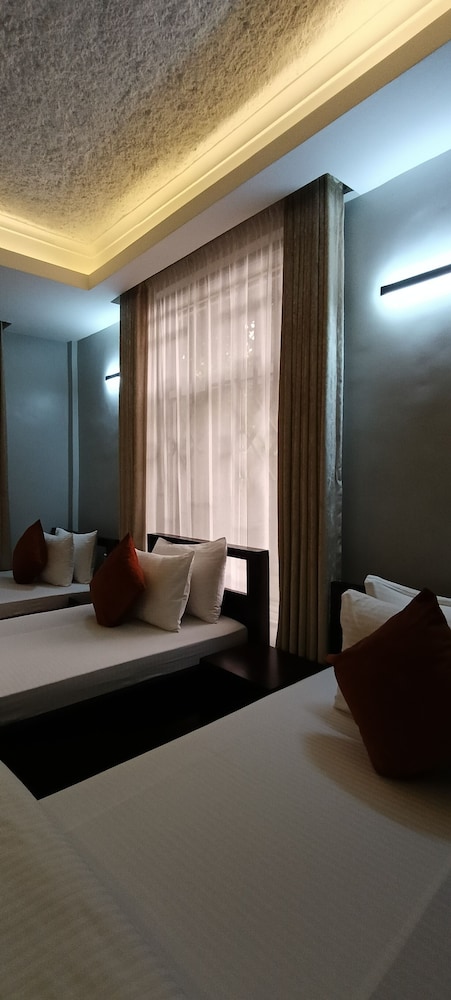 Deluxe Triple Room, Balcony, Garden View