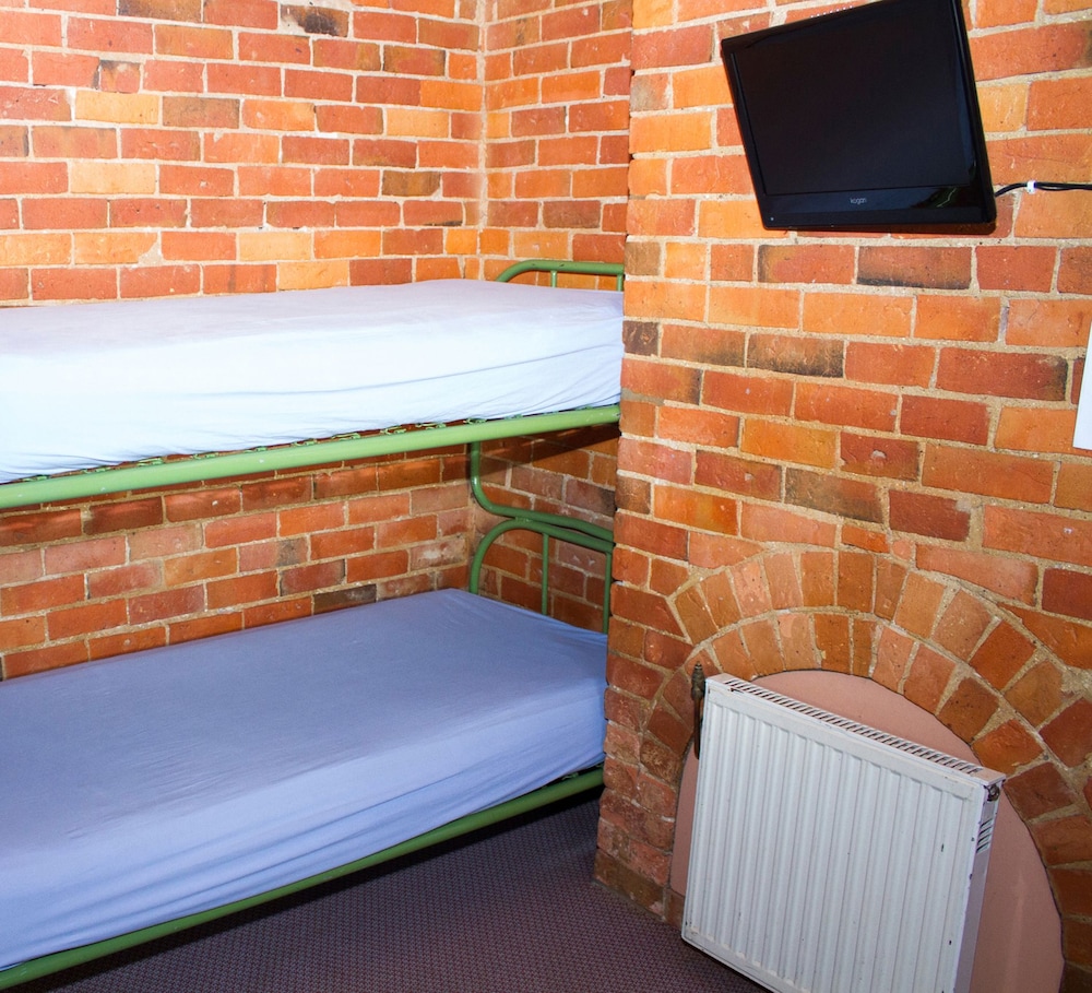 Queen bed with shared amenity