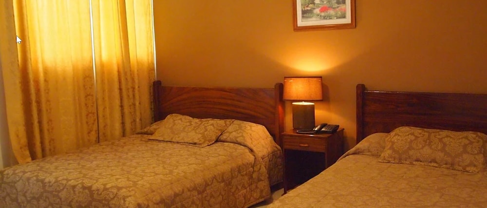 Classic Quadruple Room, 2 Queen Beds, Non Smoking photo 1