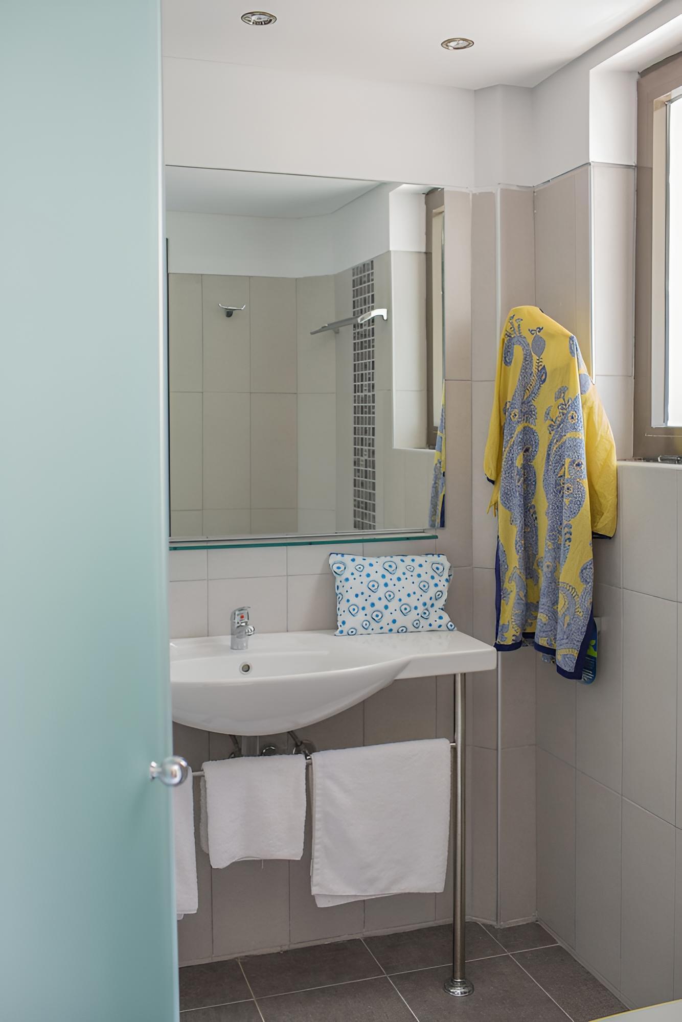 Relax in a stylish, serene bathroom retreat.