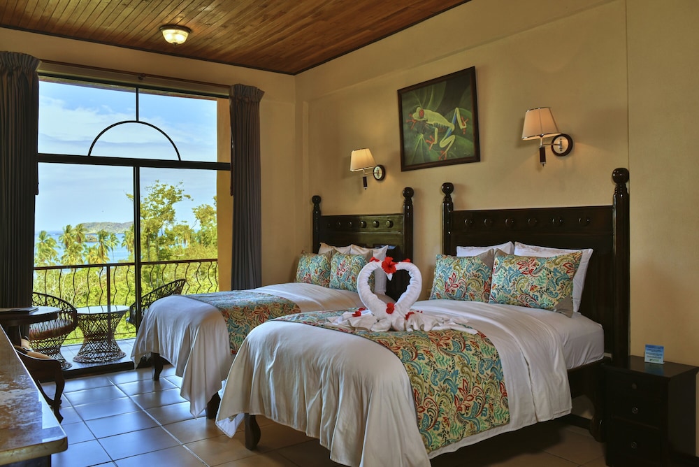Deluxe Room with Partial Ocean View Two Beds - Photo 1