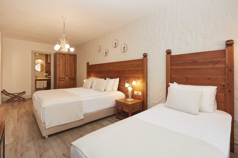 Habitación Triple Deluxe con Vista al Jardín