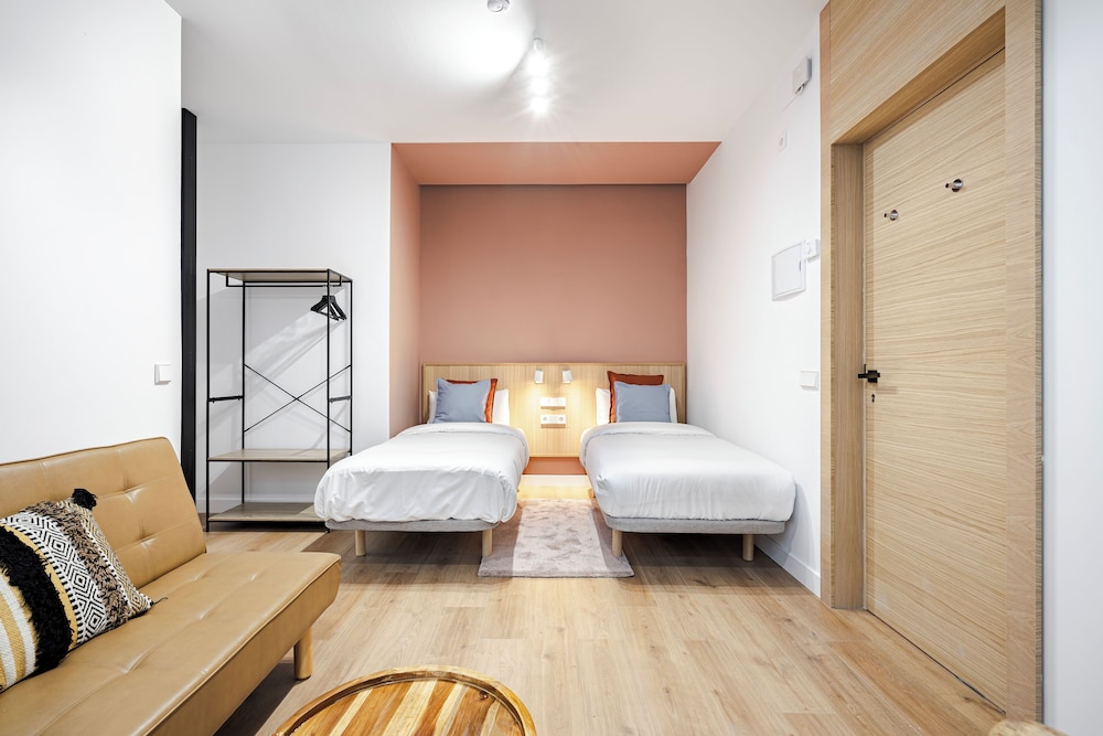 Habitación triple, varias camas