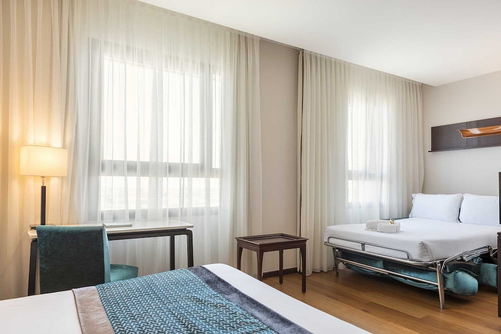 Habitación Triple, Vista a la Ciudad