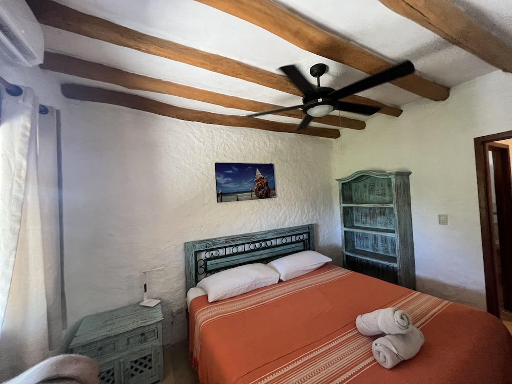 Master Suite King Bed with Partial Ocean View and Balcony