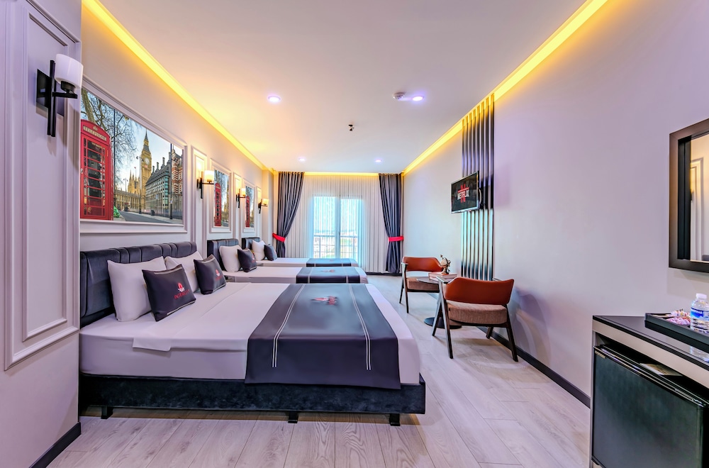 Deluxe Quadruple Room - Photo 1