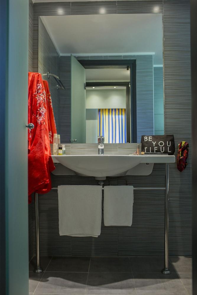 Relax in a stylish, serene bathroom retreat.