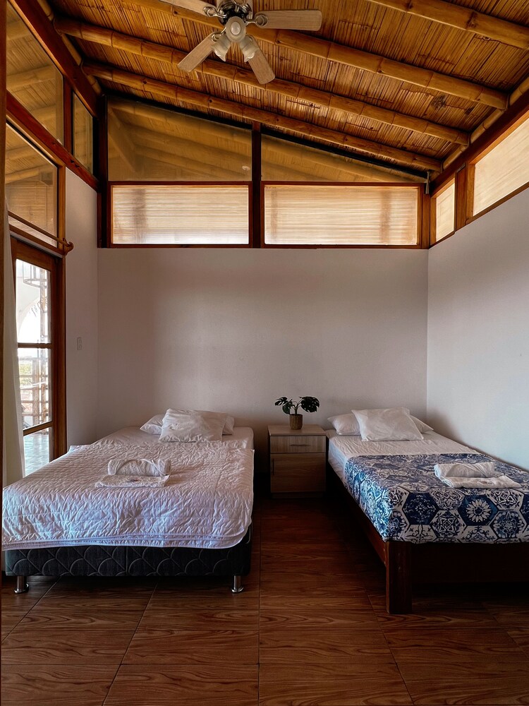 Exclusive Triple Room, Mixed Dorm, Ensuite, Partial Ocean View photo 1