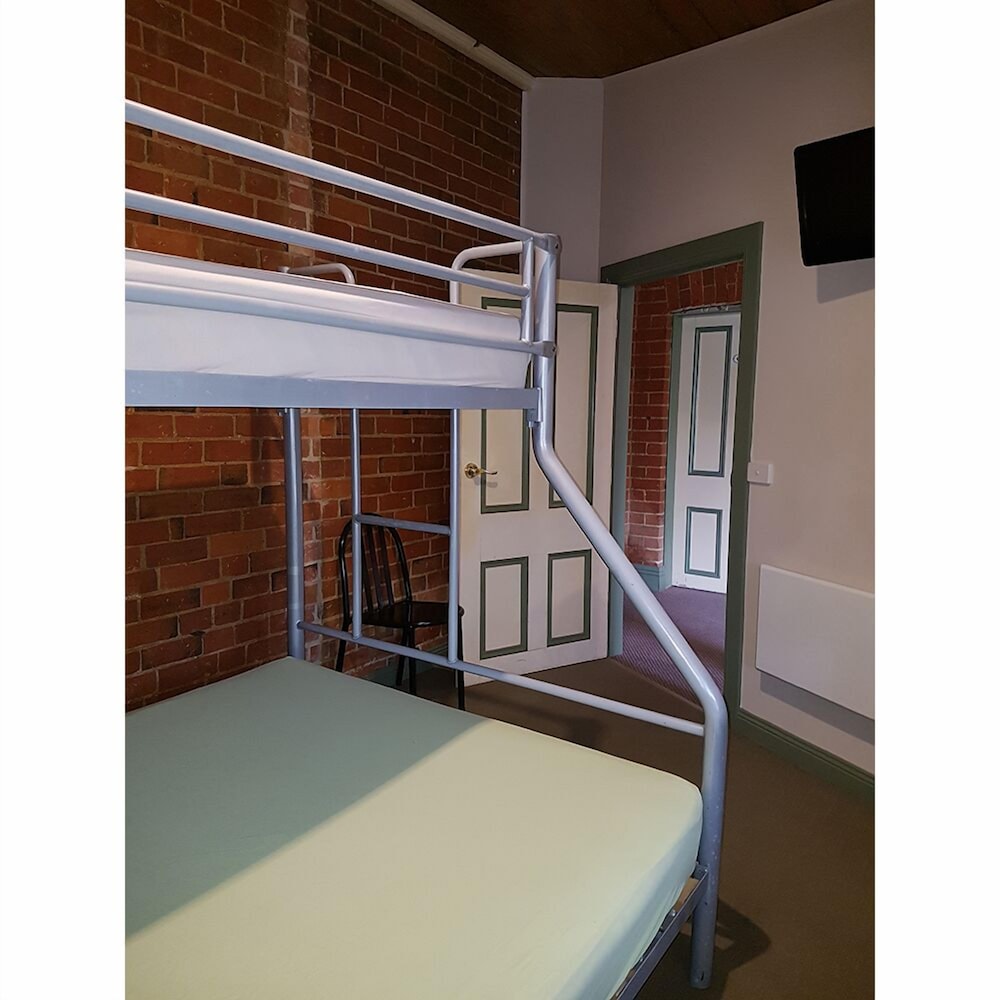 Queen bed with shared amenity