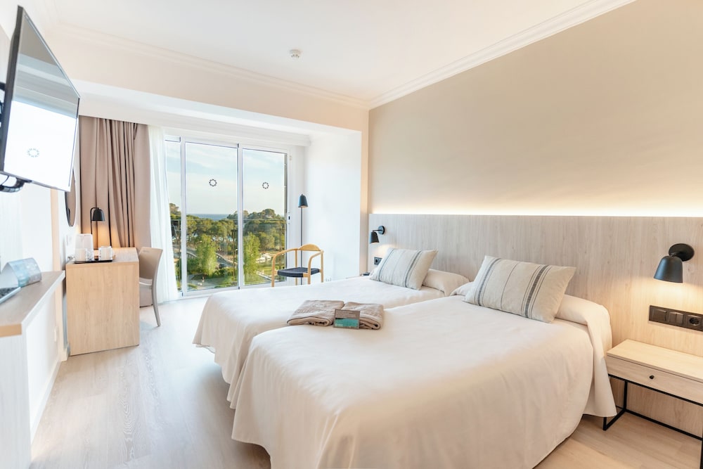 Habitación Doble con Vista al Mar (2 adultos y 1 niño)