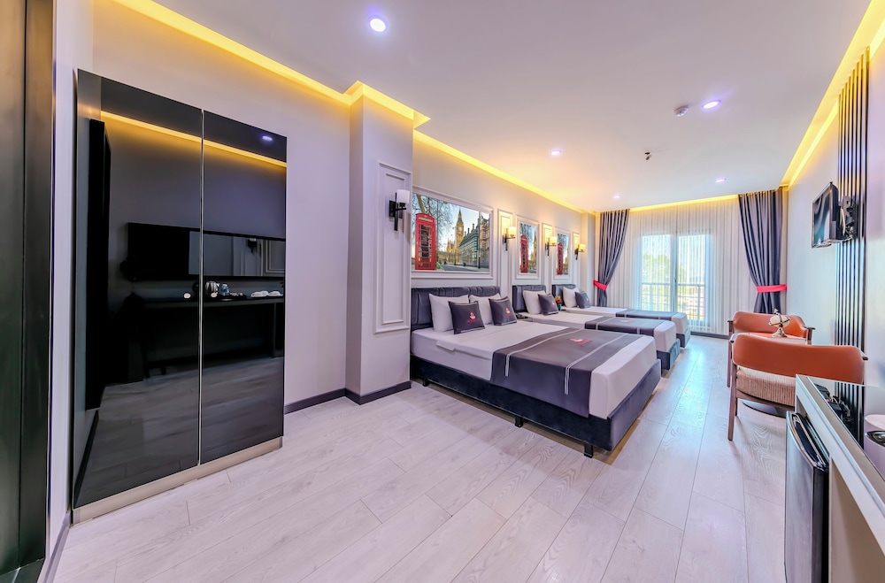 Deluxe Quadruple Room - Photo 8