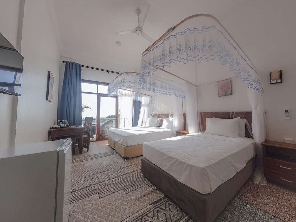 Deluxe Triple Room, Patio, Garden View