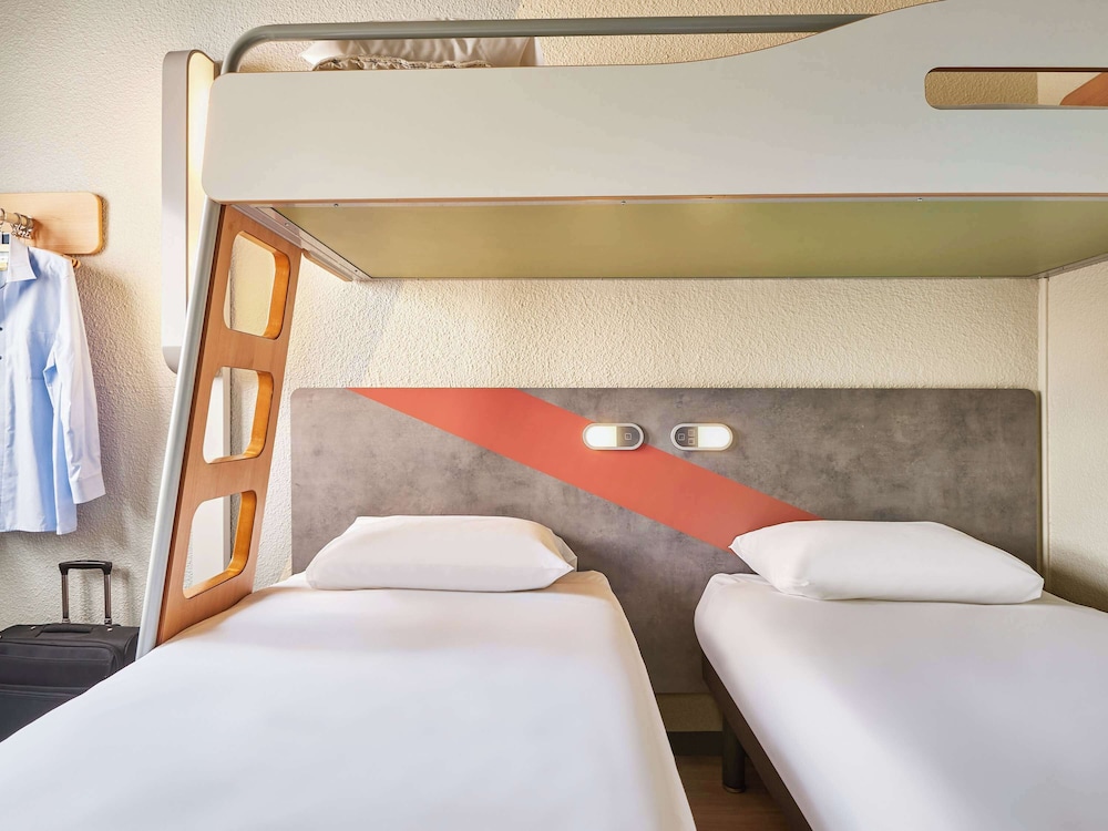 Triple Room (with 2 single beds and a bunk bed)