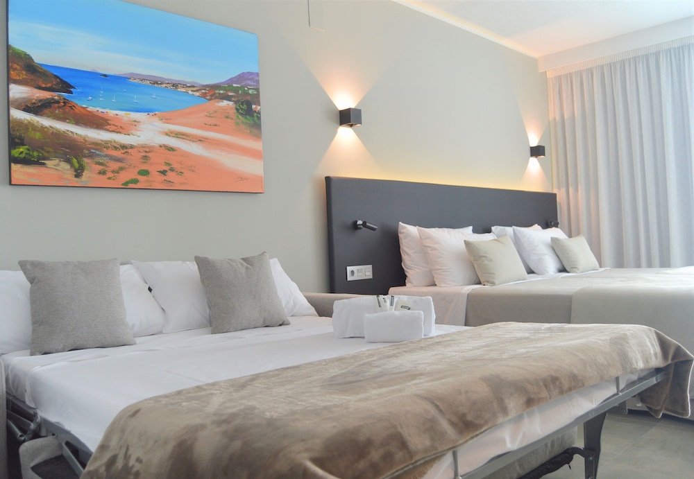 Deluxe Quadruple Room, Pool View (2 extra beds, 3 adults and 1 child)