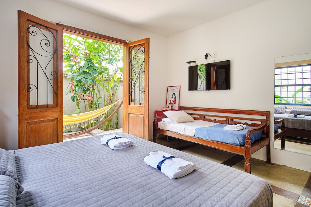 Habitación triple Deluxe con bañera de hidromasaje