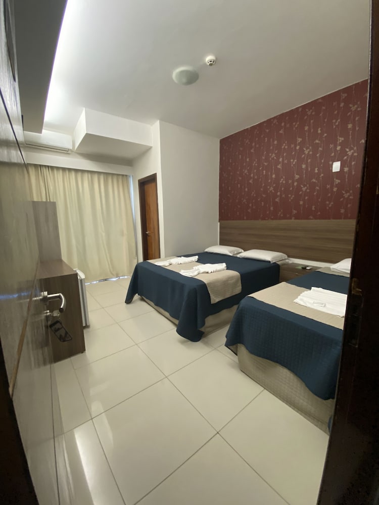 SUITE TRIPLO COM VISTA LATERAL MAR