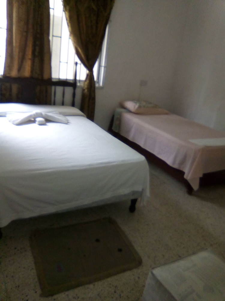 Basic Quadruple Room, 2 Double Beds, Balcony, Garden View photo 1